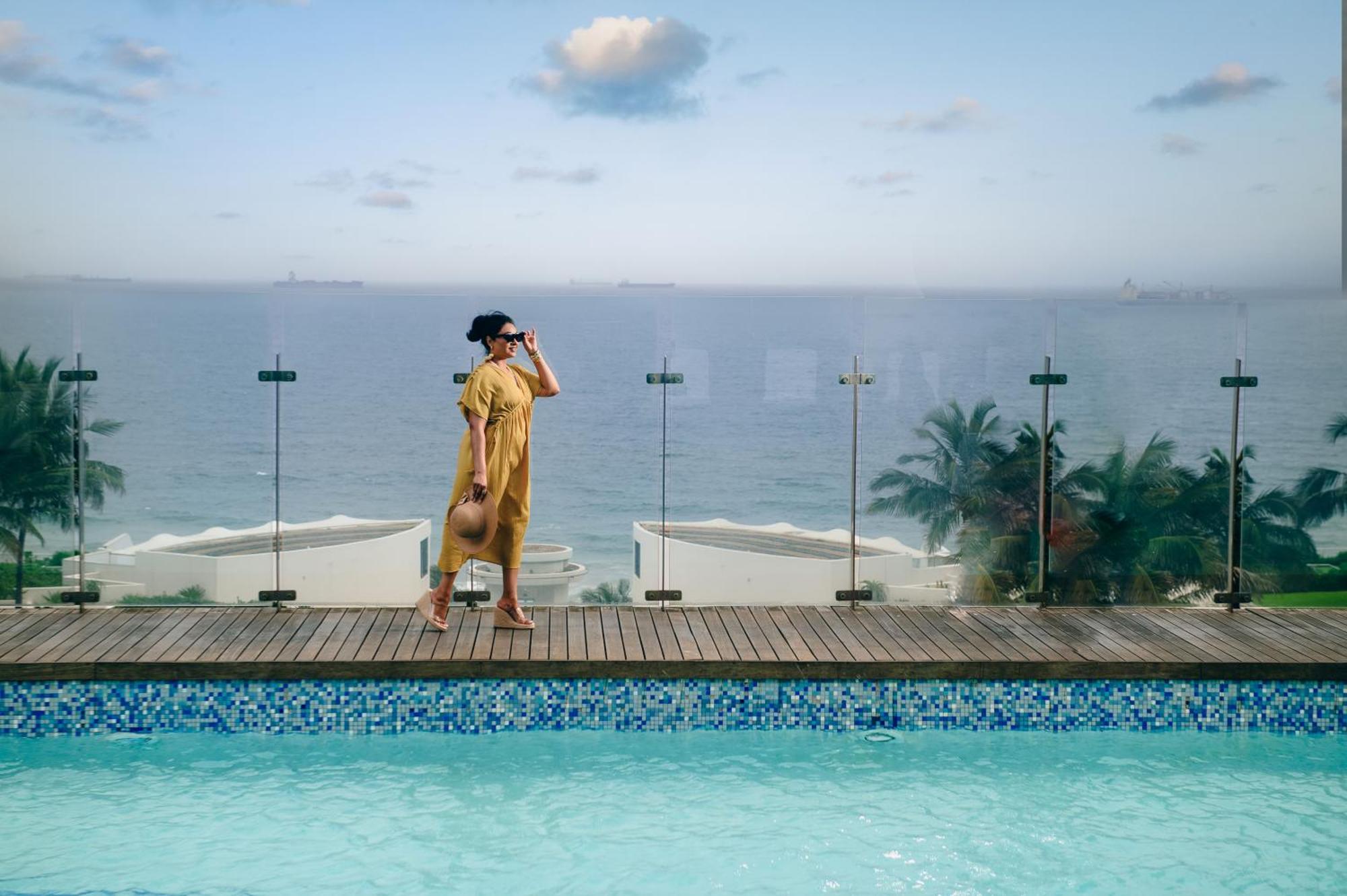 The Capital Pearls Hotel Durban Exterior photo A woman in a yellow dress