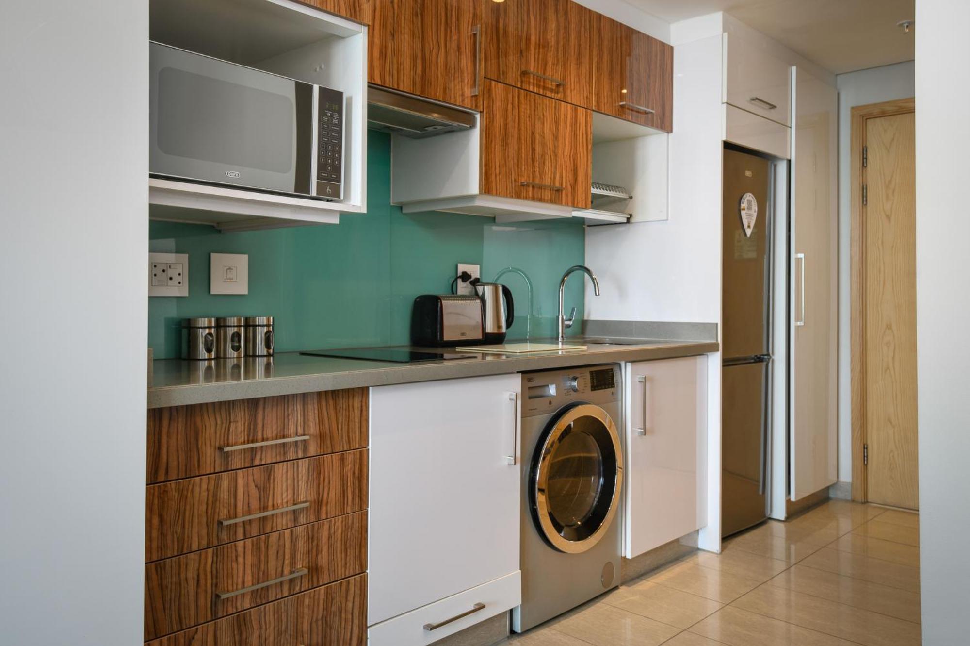 The Capital Pearls Hotel Durban Exterior photo A typical kitchen in a serviced apartment